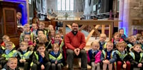 Youngsters try out vicar’s pulpit on church visit