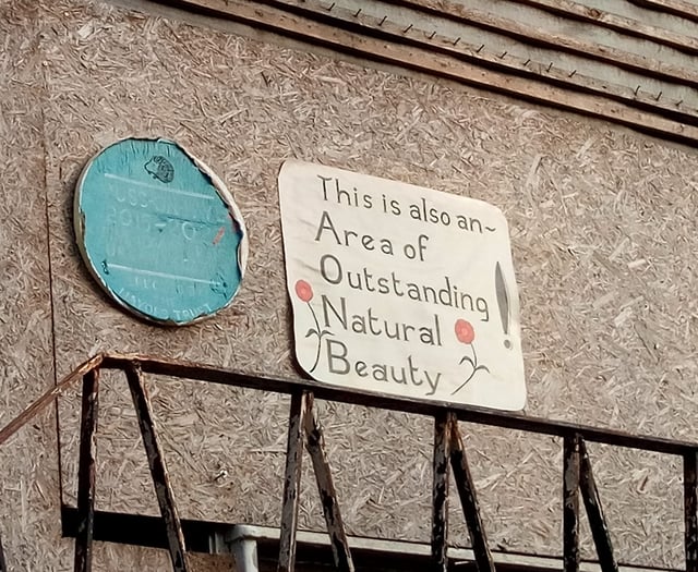 Sign of the times: blue plaque’s new neighbour