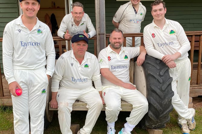 A sign of summer – Aston Ingham players relax at their ground on the Ben Savidge homemade bench