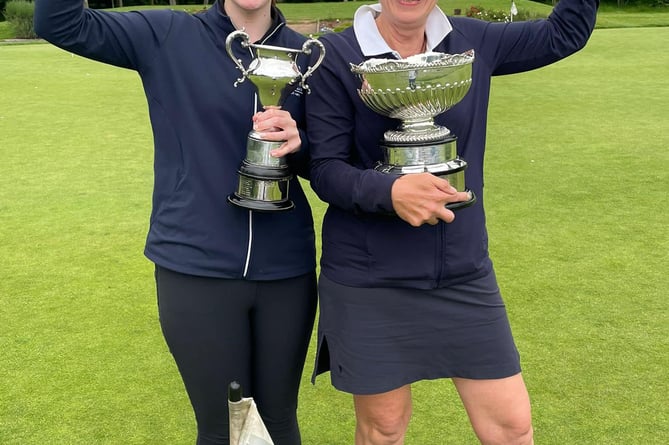 Sophie Price, left, and Nadia Stirling with their county trophies