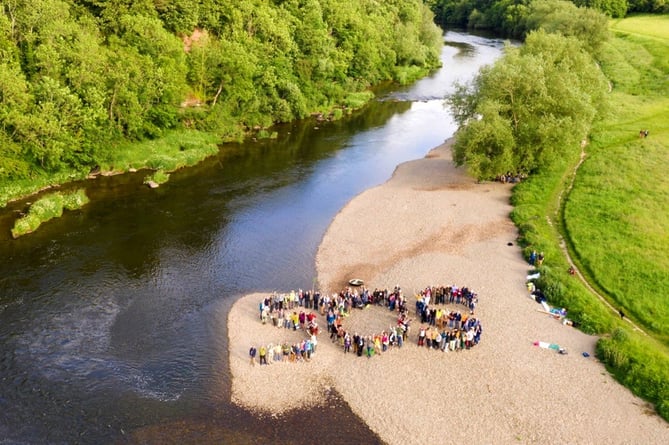 A protest upriver on the Wye spelling out S.O.S