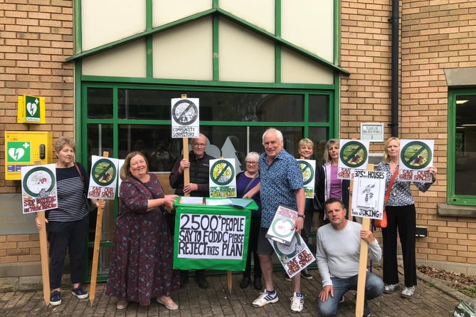 Opponents of the housing scheme outside the Forest Council offices.