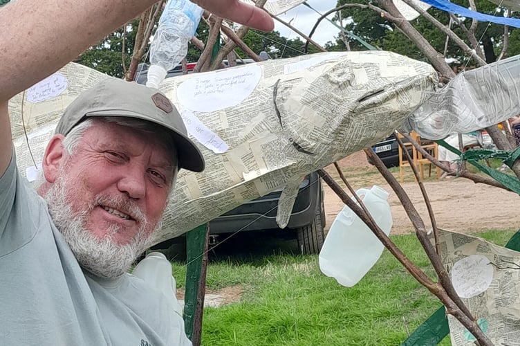 A local fisherman eyes up a salmon