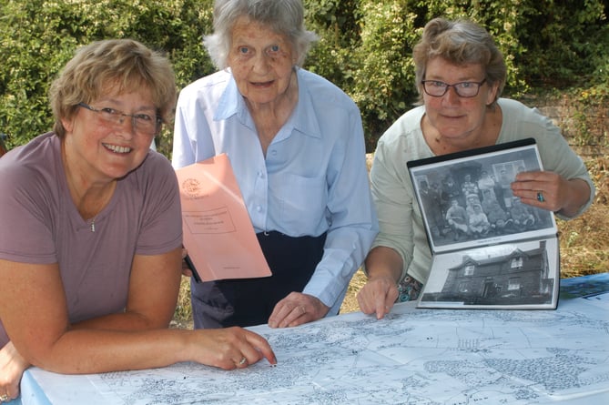 Three women and old map