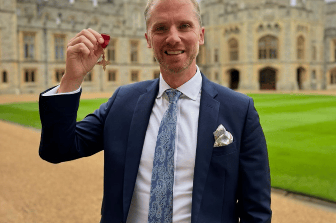 Old Monmothian Wayne Barnes with his OBE