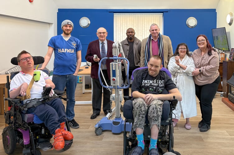 Michael Holland (Head of Freemasonry in Herefordshire), third from right, and Tim Bridgland-Taylor (Herefordshire Freemasons’ Charity Steward), third from left. They are shown with Steve, Matthew and Helen, and staff members, Georgia (Registered Manager), John and Dylan (Enabling Support Workers)